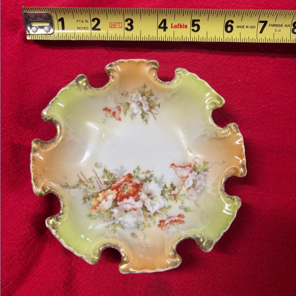 Vintage scalloped trinket dish from England. Perfect condition.